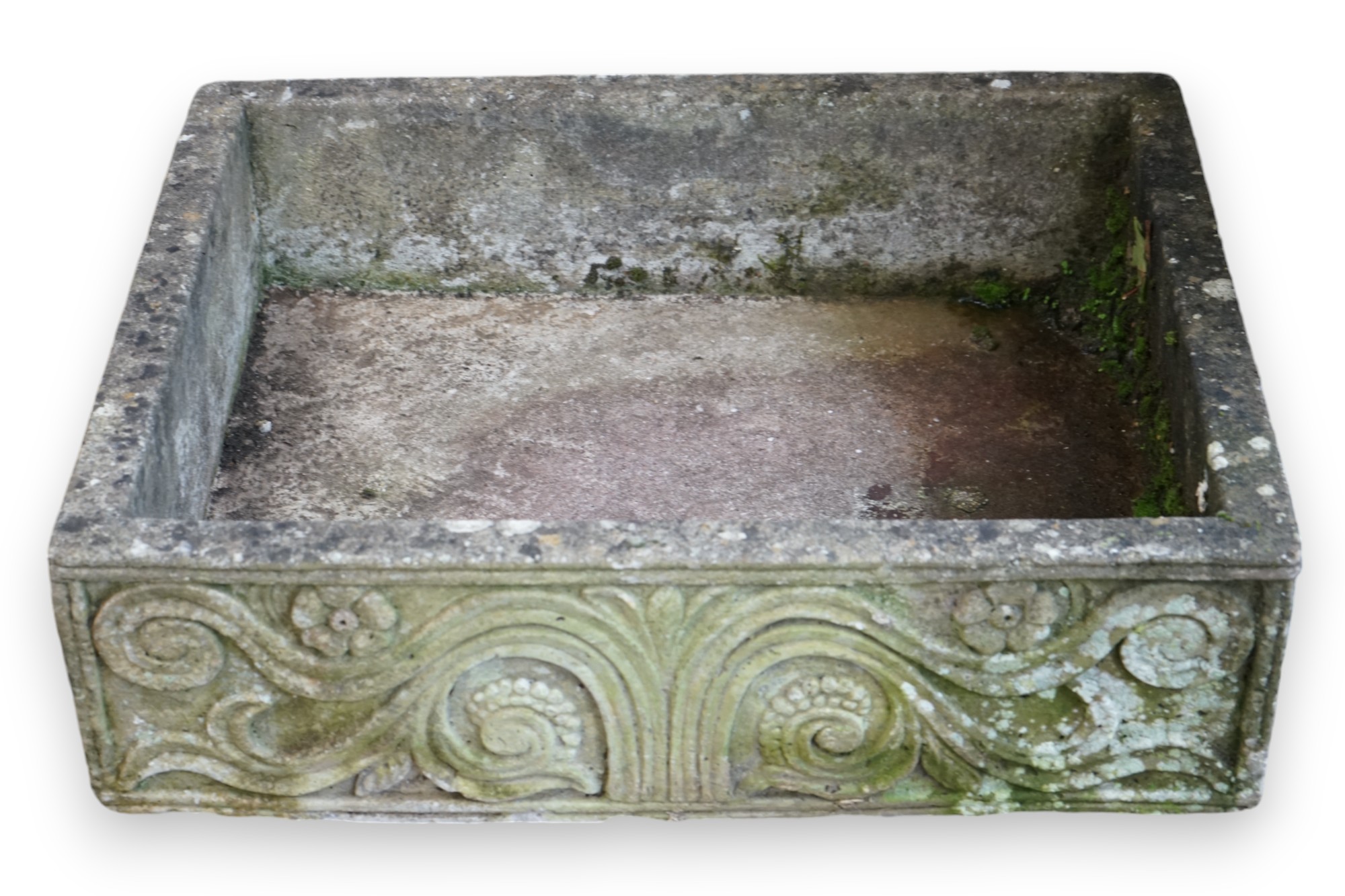 A rectangular reconstituted stone garden trough